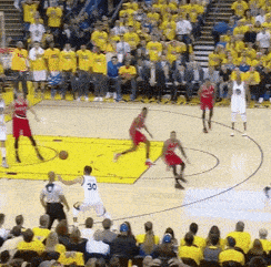 a basketball game is being played in front of a crowd with a player wearing the number 30 on his jersey