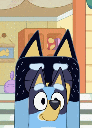 a blue and yellow cartoon dog with a black head