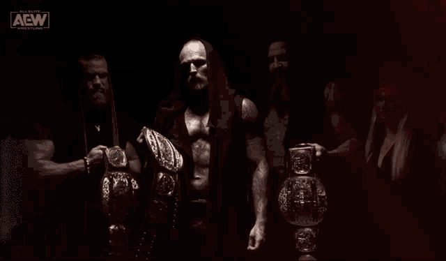a group of wrestlers with aew written on the bottom