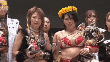 a woman holding a trophy that says " dream girl "