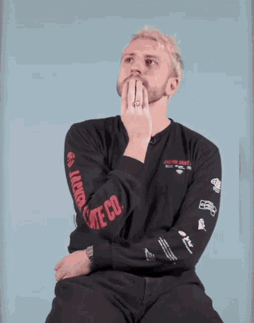 a man wearing a shirt that says liberty on the sleeve