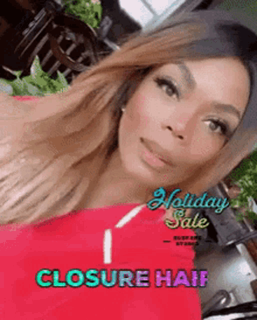 a woman wearing a red shirt with the words holiday sale closure hair