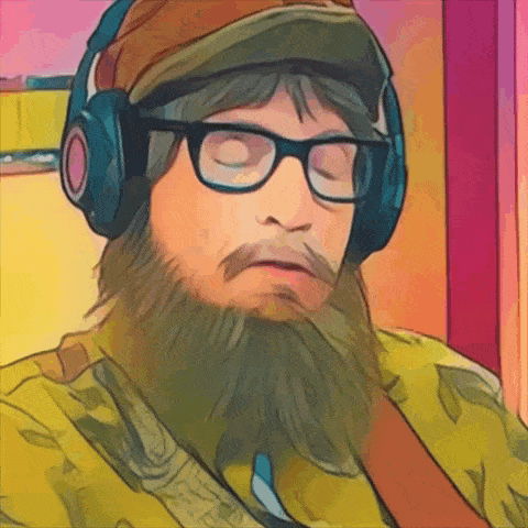 a man with a beard and glasses wearing headphones and a hat