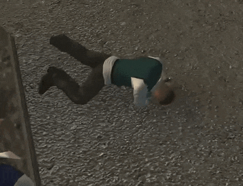 a man is laying on the ground with his legs crossed