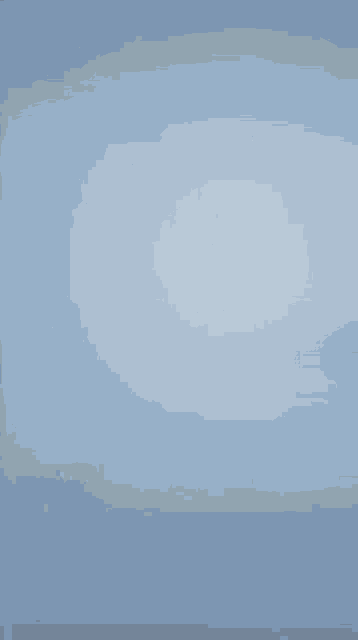 a yellow object with a light inside of it is laying on a blue surface