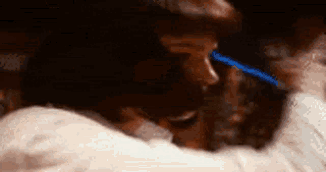 a man is holding a woman in his arms while they are dancing .