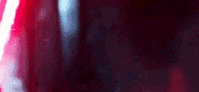 a close up of a red and white light on a black background .