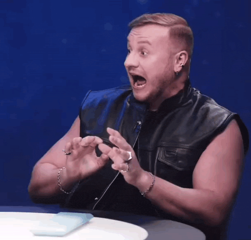 a man in a leather vest says aa aa aa aa aa