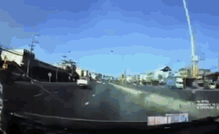 a car is driving down a highway with a sign that says ' i 'm sorry '