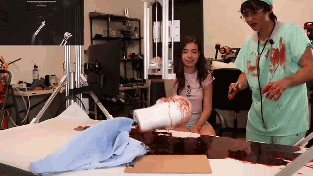 a man in a surgeon costume is pouring blood into a woman 's leg