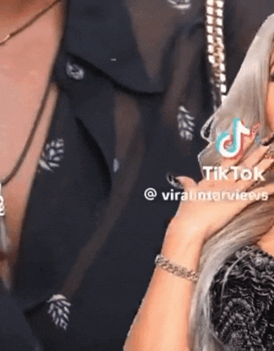 a woman with a tiktok icon on her hand