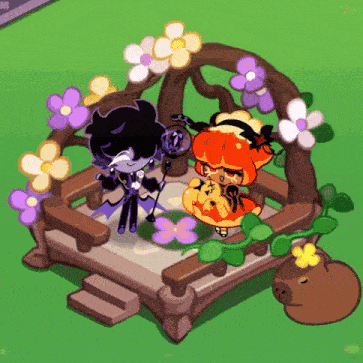 a couple of cookies standing next to each other on a wooden bench surrounded by flowers .