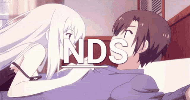 a boy and a girl are kissing with the word nds in the background .