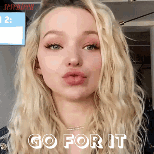 a woman with blonde hair and the words go for it behind her