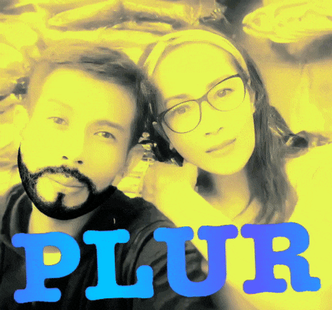 a man and a woman are standing next to each other with the word plur written in blue letters