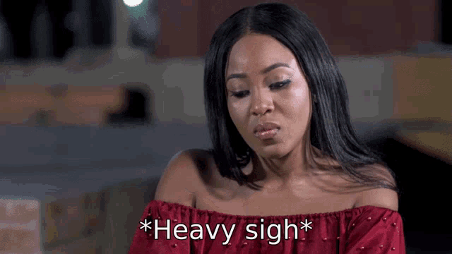 a woman wearing a red off the shoulder top says " heavy sigh "