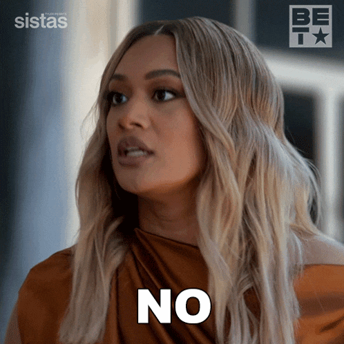 a woman says no in front of a sign that says sistas