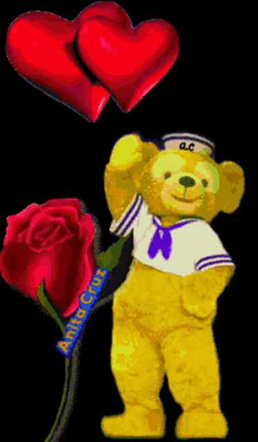 a teddy bear in a sailor outfit holds a red rose and two hearts
