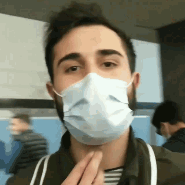 a man with a beard wearing a mask