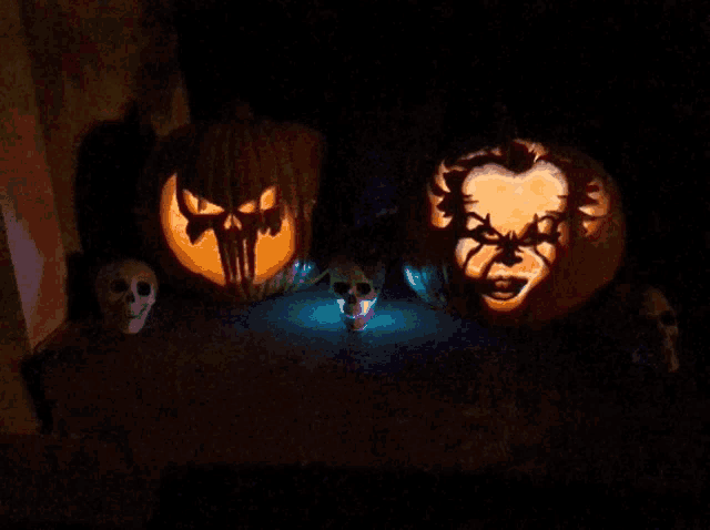 a pumpkin with a skull carved into it 's face