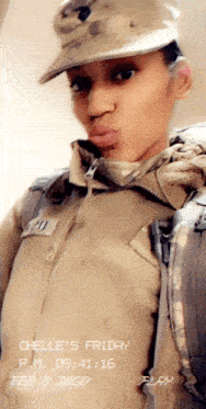 a woman in a military uniform is taking a selfie on friday february 8th 2020