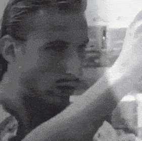 a close up of a man 's face with a blurred background