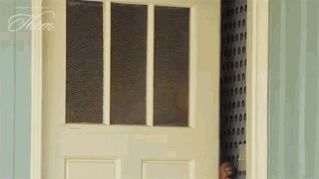 a white door has the word them on it