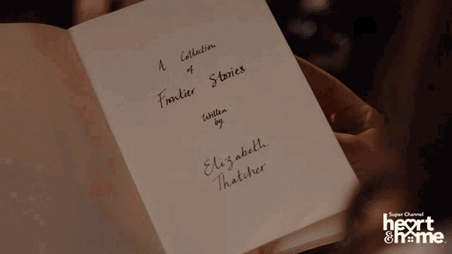 a person is holding a book titled a collection of family stories written by elizabeth thatcher
