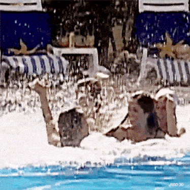 a man and a woman are laying in a swimming pool with a watermark that says rbd 3d
