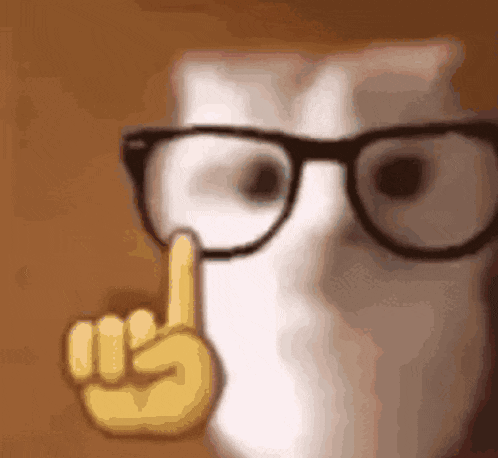a close up of a cat wearing glasses and making a finger gesture