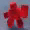 a blurred image of a red gummy bear on a table .