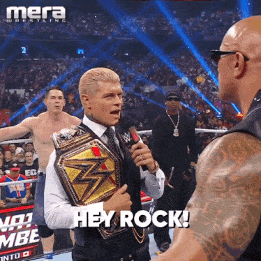 a man holding a wrestling belt says " hey rock "