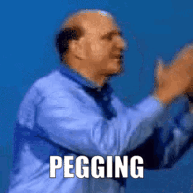 a bald man in a blue shirt and tie is clapping his hands with the word pegging written below him .