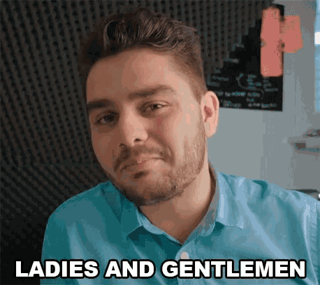 a man with a beard wearing a blue shirt says ladies and gentlemen .