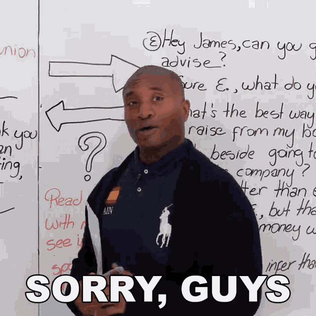 a man standing in front of a white board with the words sorry guys on the bottom