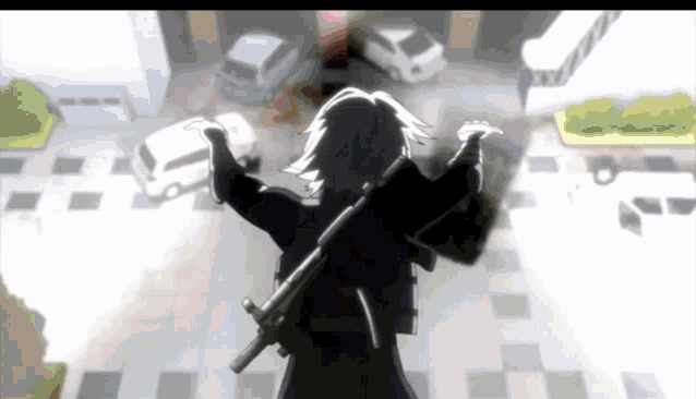 a person holding a gun in front of a building