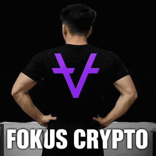 a man wearing a black t-shirt with a purple cross on it and the words fokus crypto below him