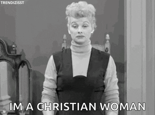 a black and white photo of a woman standing in front of a mirror and saying `` i 'm a christian woman '' .