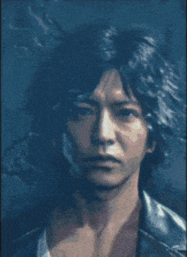 a close up of a man 's face with a black background