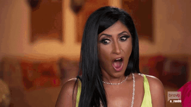 a woman with a surprised look on her face is on bravo tv