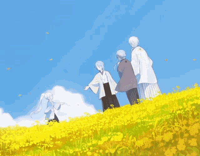a group of people standing on top of a field of yellow flowers