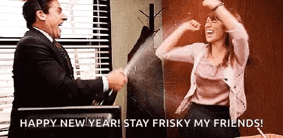 a man and a woman are celebrating new year 's eve in an office with champagne .