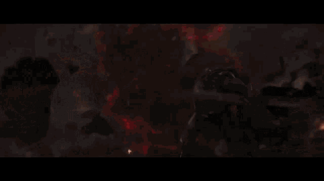 a close up of a red light coming out of a person 's mouth .