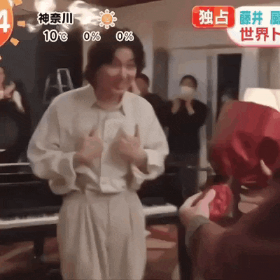 a man in a white shirt is standing in front of a piano with a sign that says 10 degrees