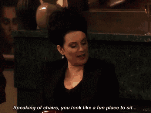 a woman in a black suit says speaking of chairs you look like a fun place to sit ..