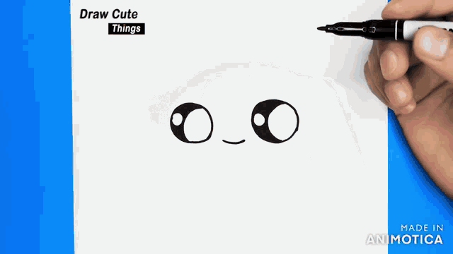 a person is drawing a face with a marker on a piece of paper that says " draw cute things "