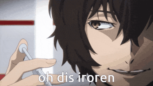 a close up of a person holding a syringe and the words oh dis iroren