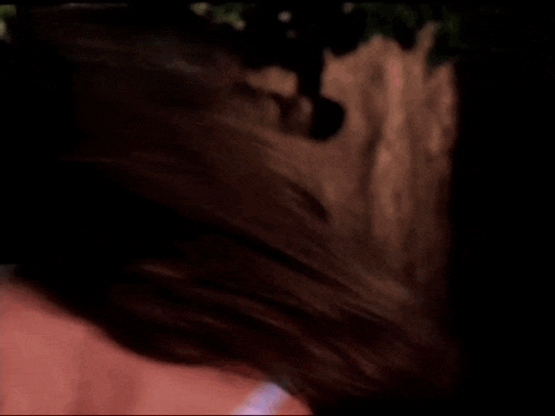 a close up of a woman 's face and neck