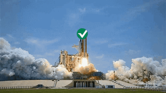 a rocket is being launched with a green check mark on top
