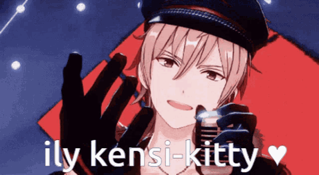 a man in a hat is holding a microphone with the words ily kensi-kitty above him